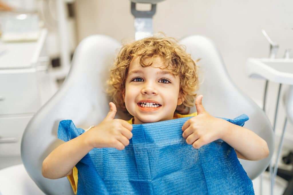 blog: pediatric dental care rexburg, pediatric dentist, and child in dental chair