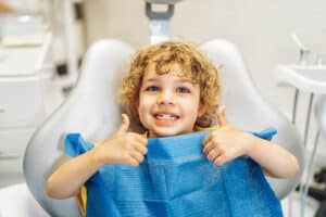 blog: pediatric dental care rexburg, pediatric dentist, and child in dental chair